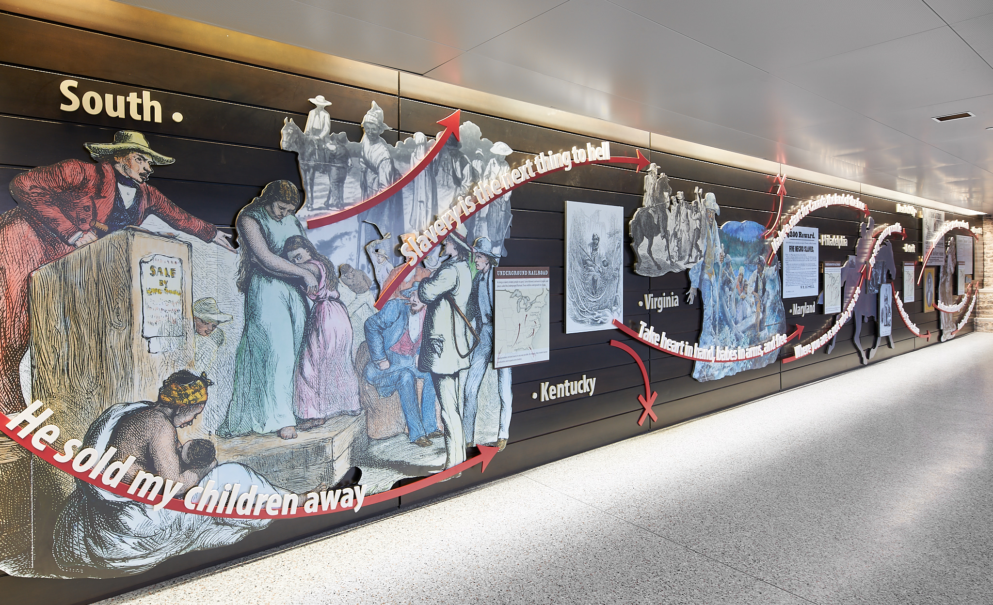 Figure 1. Underground Railroad historical overview wall and gathering area. Niagara Falls Underground Railroad Heritage Center, Amtrak Station Atrium. Photo: Copyright 2018 Kim Smith Photo and Seth Frankel/Studio Tectonic.