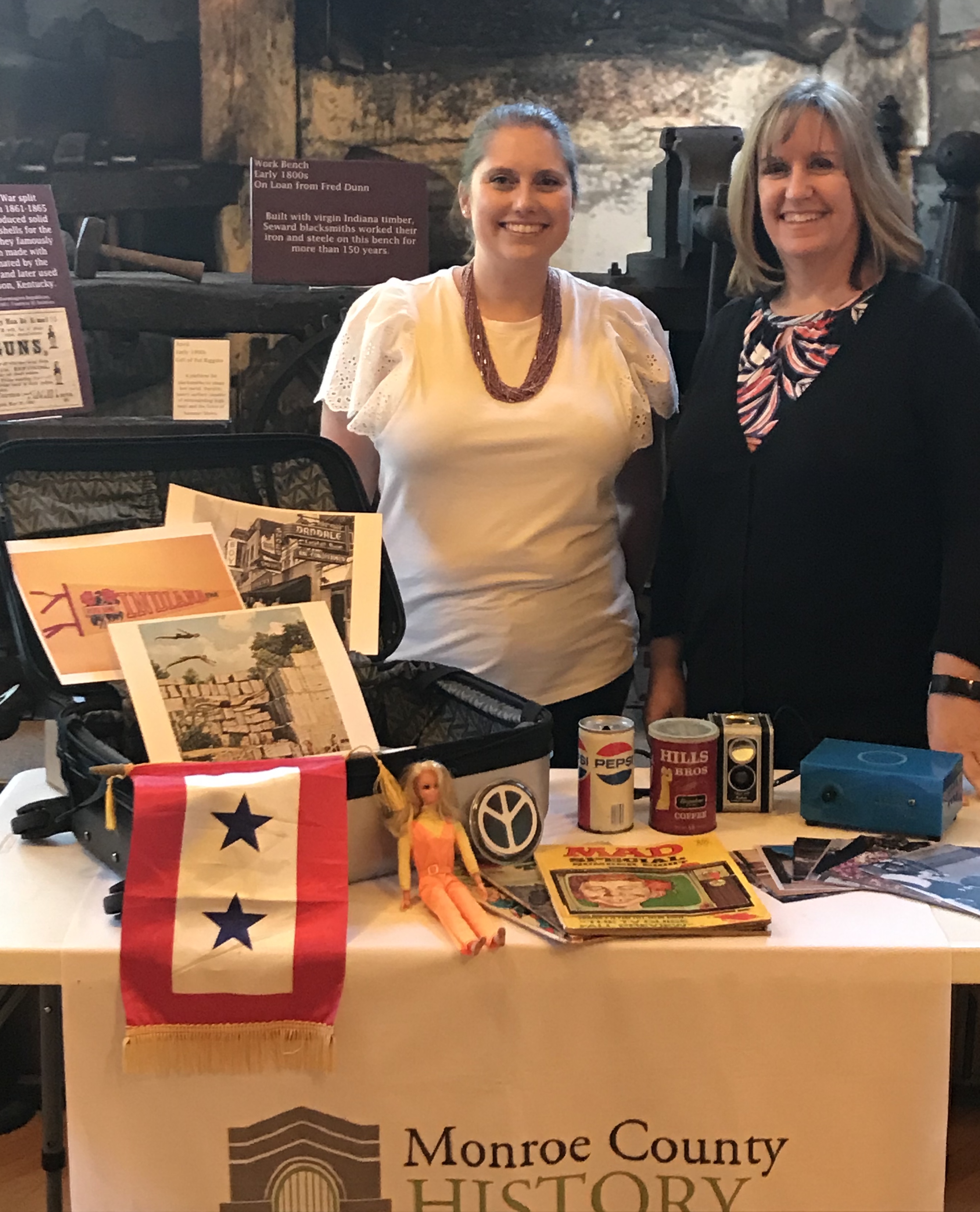 Figure 1: Hilary Fleck (left), Collection Manager, and Susan Dyar (right), Director, of the Monroe County History Center pose with the first memory box.