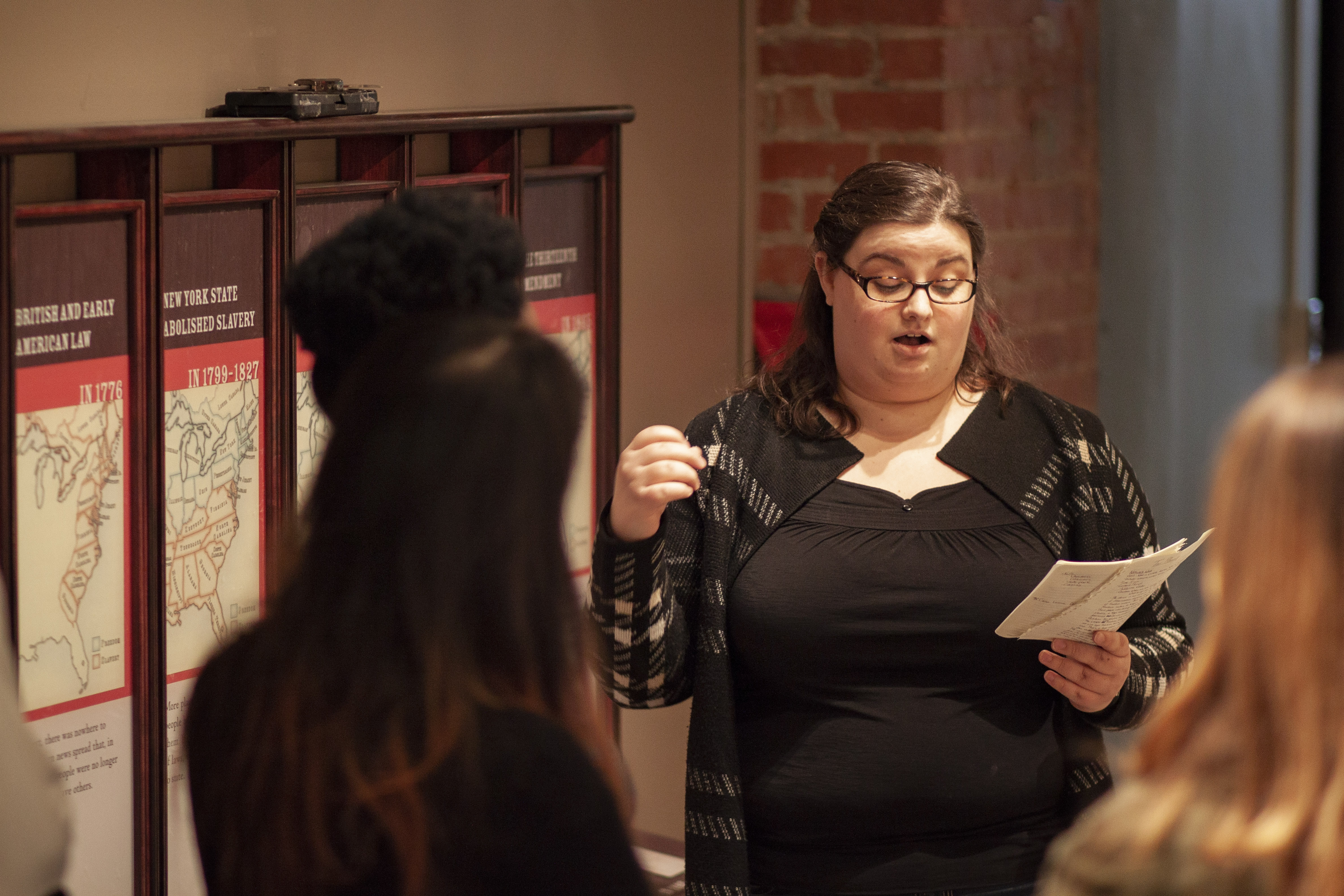 Figure 7. A visitor experience specialist leads a group of visitors through a facilitated dialogue tour. Niagara Falls Underground Railroad Heritage Center, Arrival Gallery. Courtesy Niagara Falls Underground Railroad Heritage Center.
