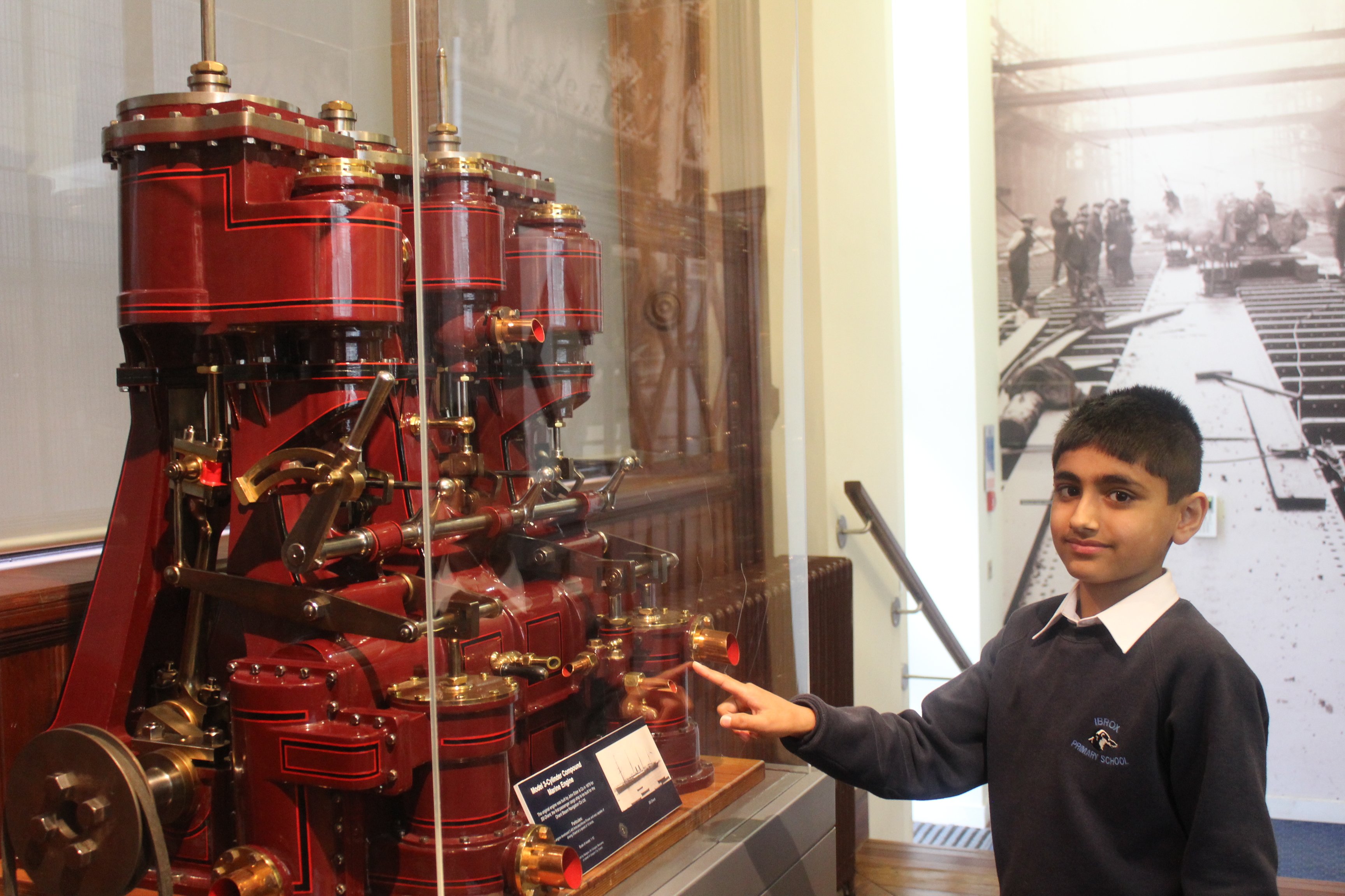 Figure 2: Ibrox pupil exploring a copy of a Model-3 Cylinder Compound Marine Engine designed by John Elder and Co. in 1875.